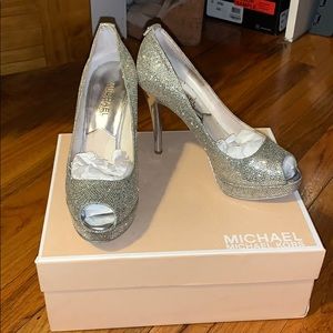 Silver glitter Michael Kors peep toe heels.